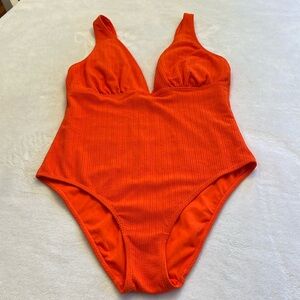Orange one piece swimsuit from Primark. Size 12. Worn once.